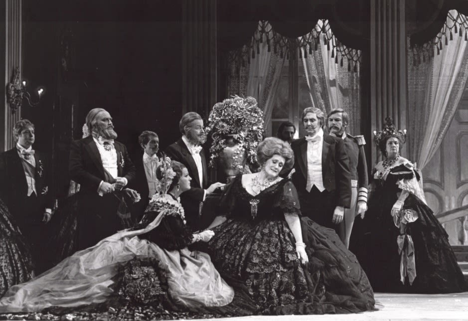 Joan Sutherland reclines on a chair looking distressed in a performance of La Traviata at the Sydney Opera House.