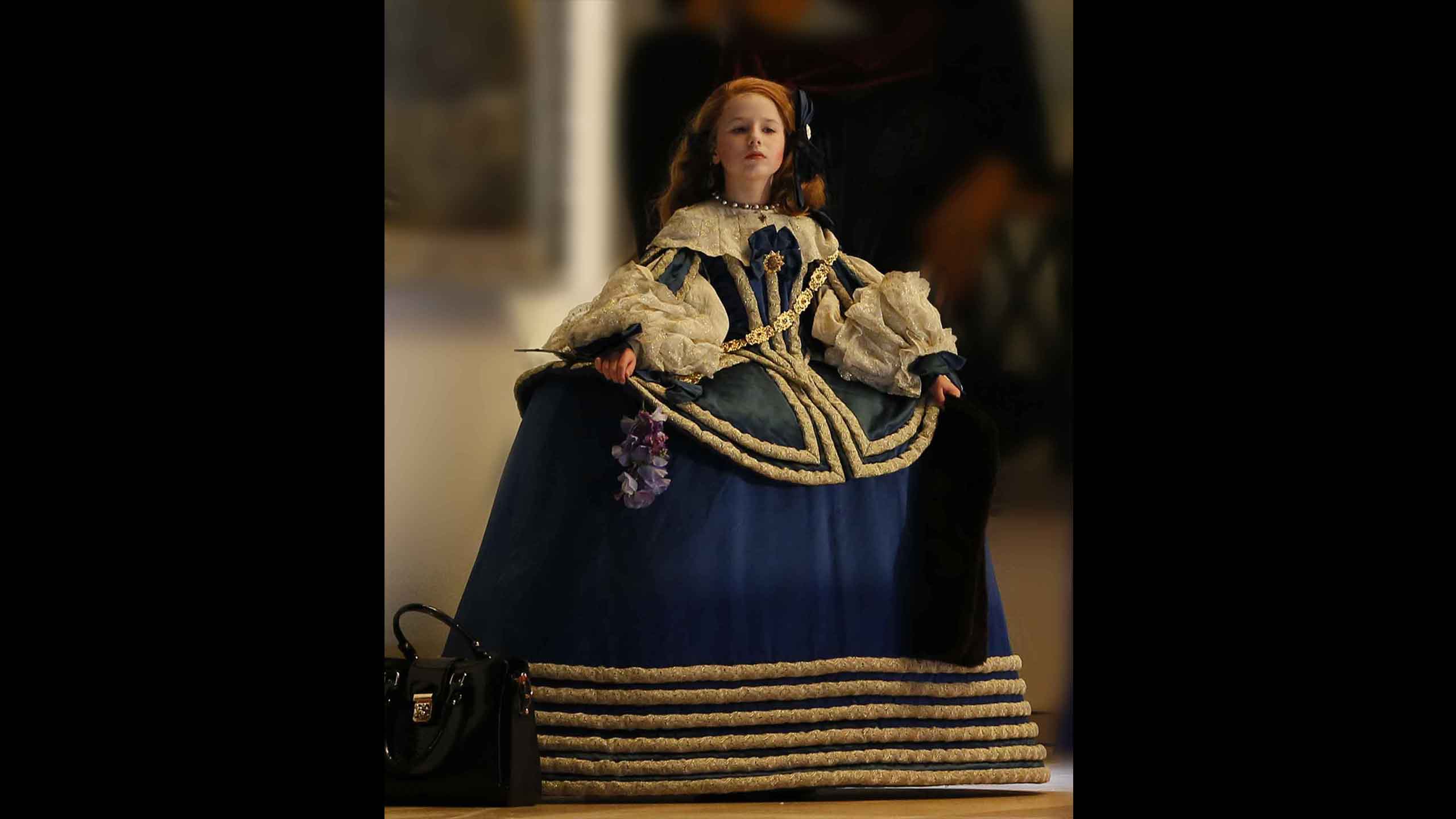 A child actor dressed as the Velázquez portrait.
