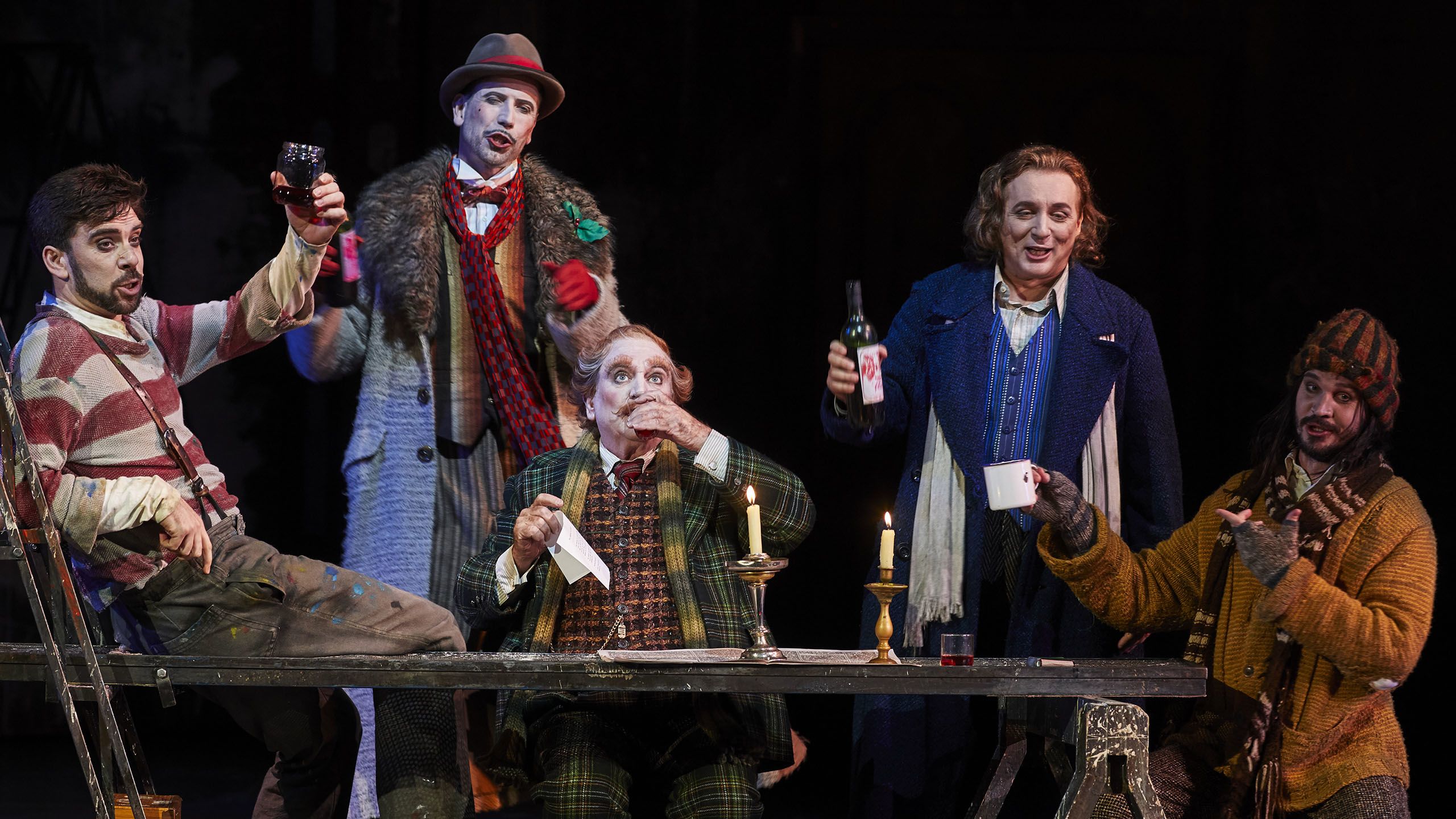 Five men drinking in a scene in La Boheme