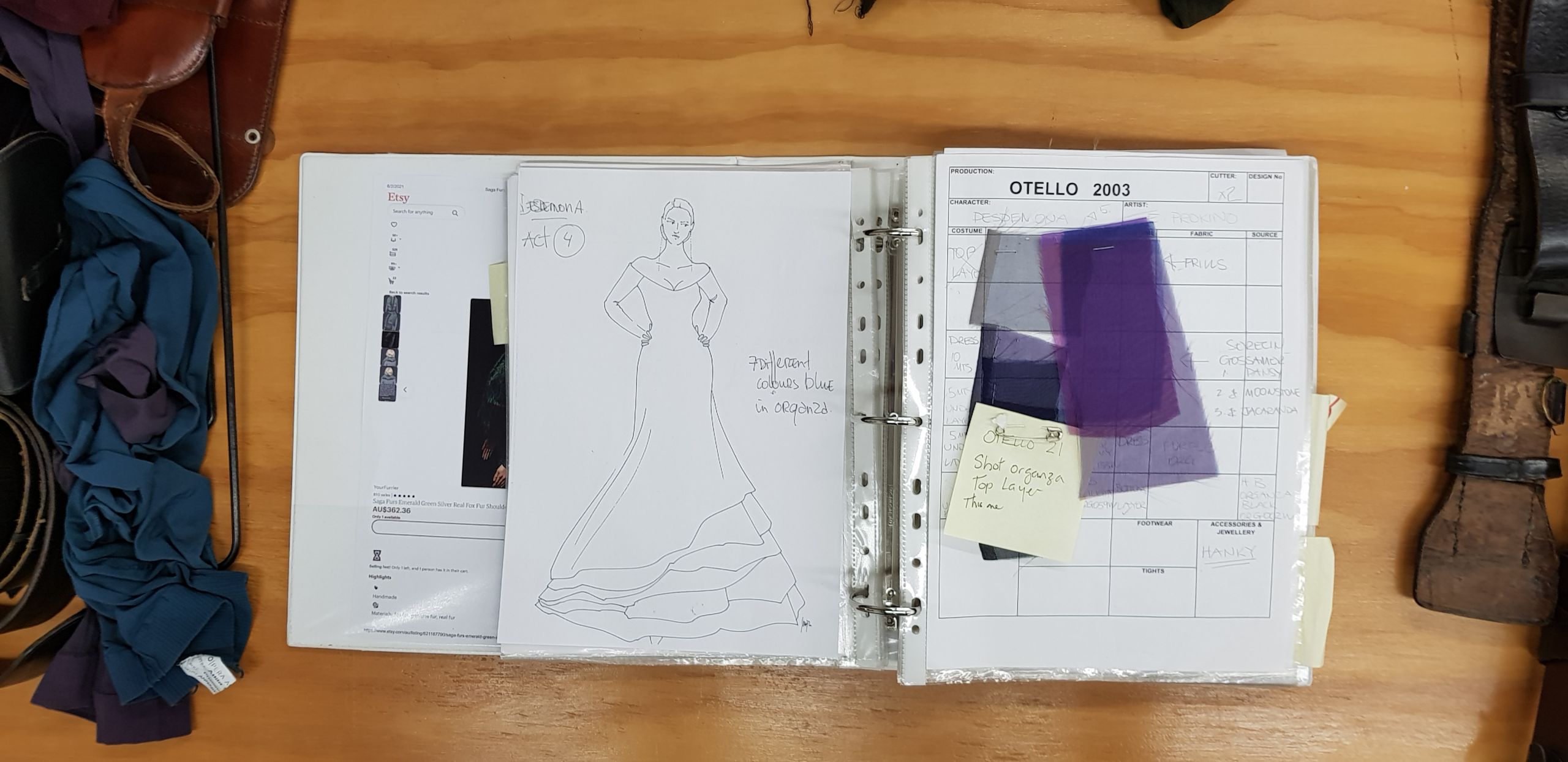 A sketch of a long gown with fabric swatches.